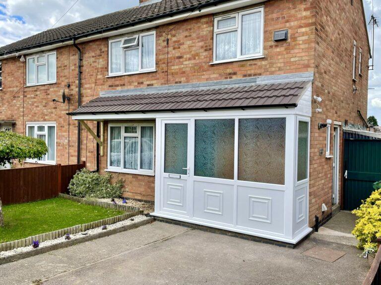 uPVC Double Glazed White Porch with Frosted Glass Front Door & Tiled Roof - Installed by Phair Windows & Glass, Leicester, Leicestershire