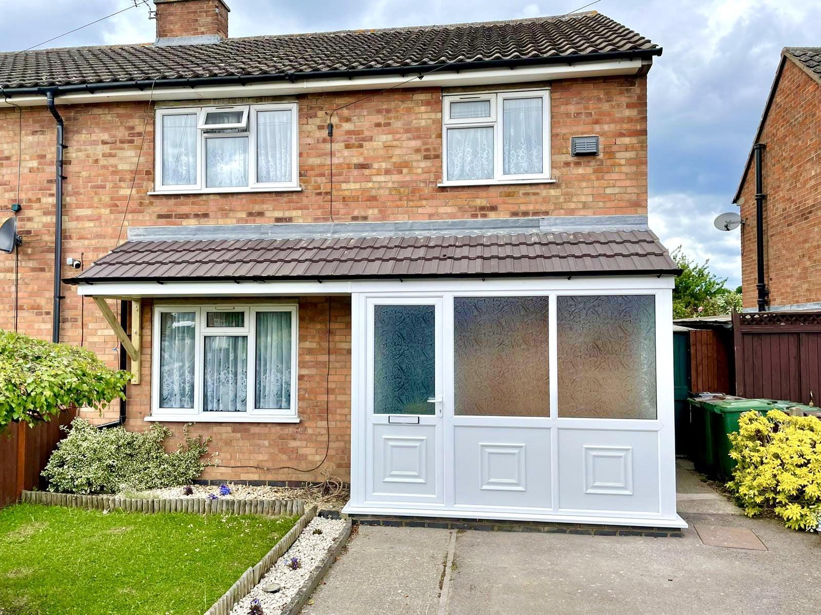 uPVC Double Glazing White Porch with Frosted Glass Front Door - Installed by Phair Windows & Glass, Leicester, Leicestershire