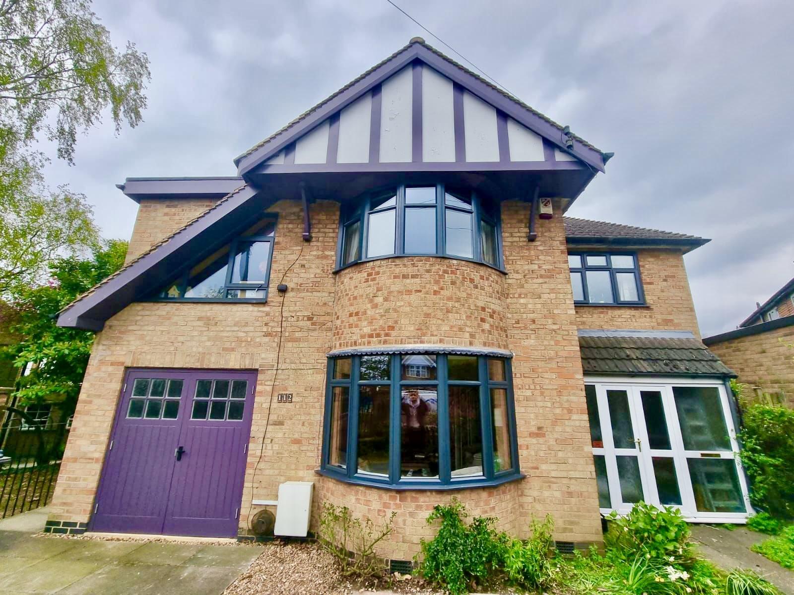 House with new anthracite grey aluminium windows installed by double glazing Leicester