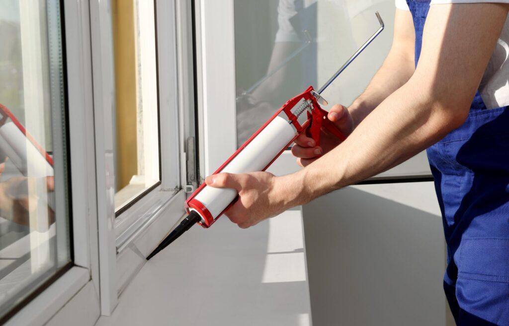 Using sealant to stop draughts in a uPVC window