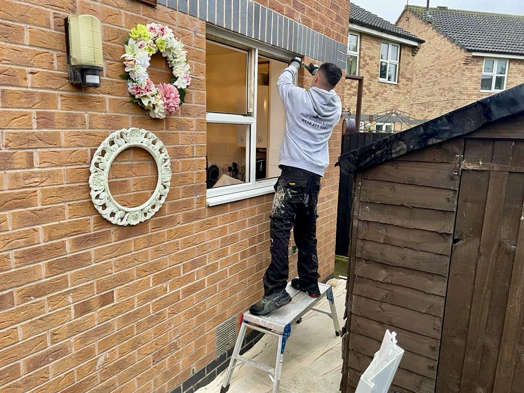 uPVC window being fitted by window and door company Leicester