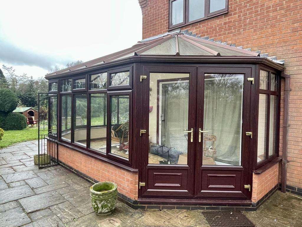 uPVC wood grain effect windows on a conservatory