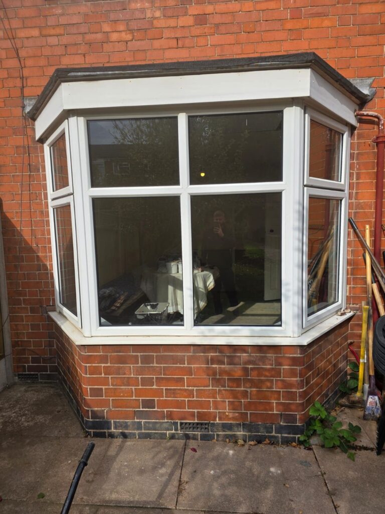 Before bay window to French door installation