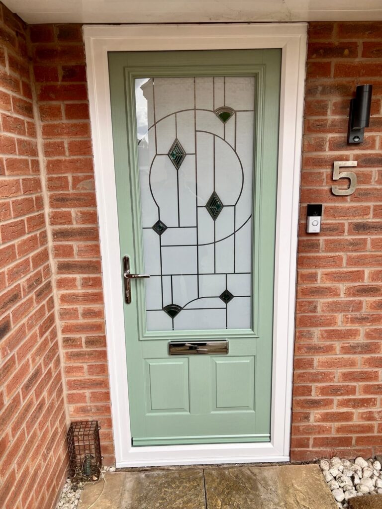 Chartwell green composite front door installation with patterned glass