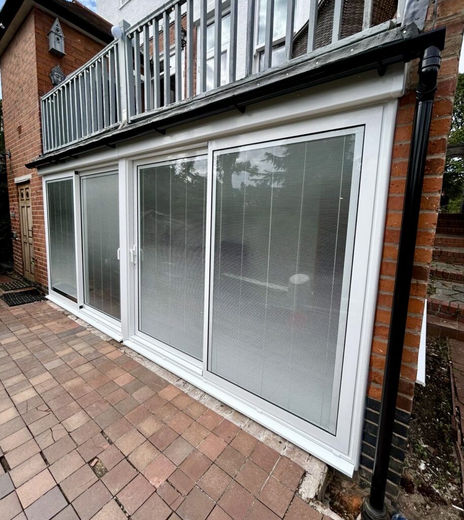 Aluminium sliding patio doors with magnetic integral blinds installed in Leicester