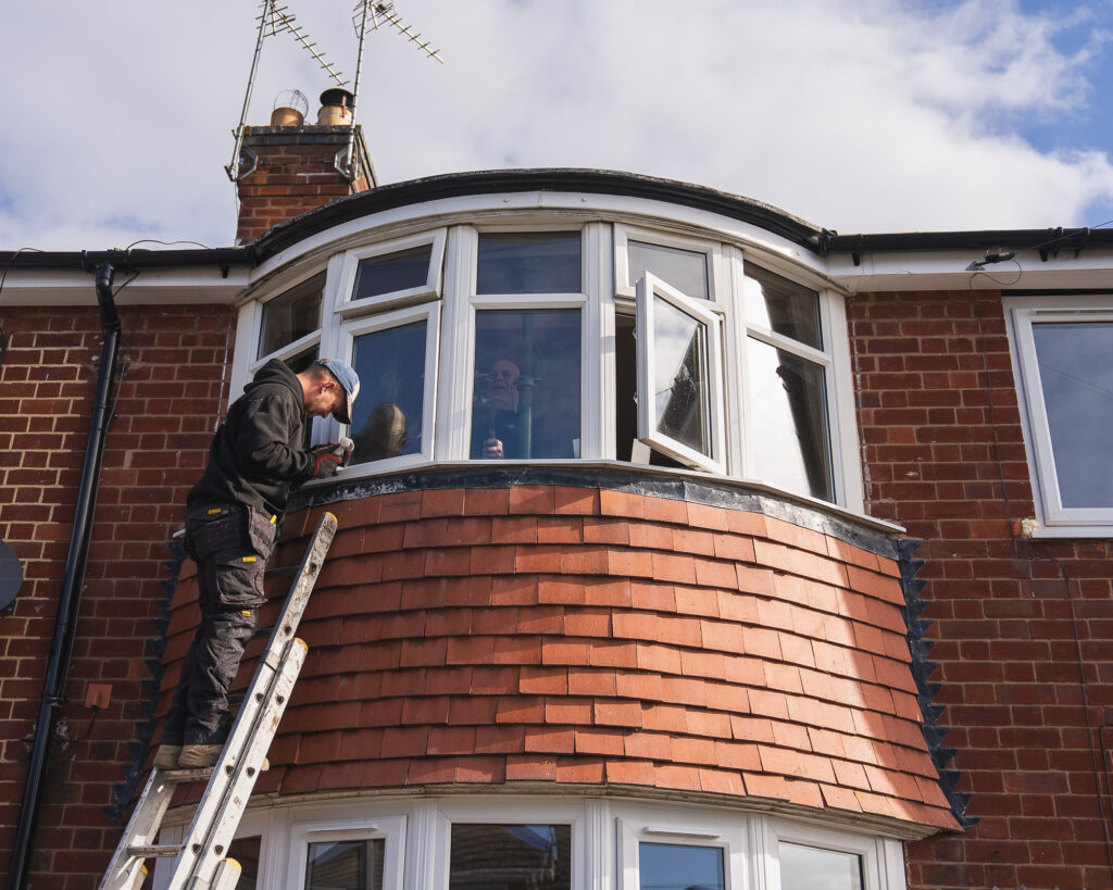 Phair Windows fitting team installing windows on terraced property