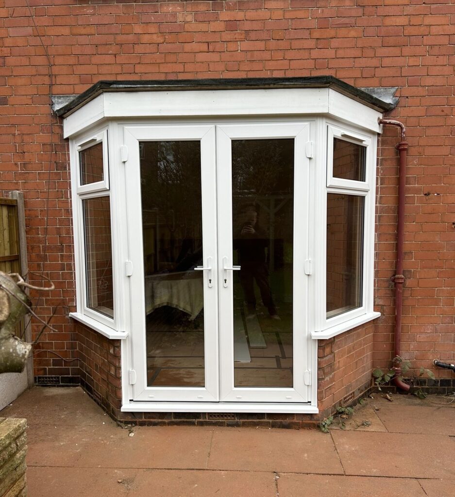 Bay window to uPVC white French door and flag windows transformation