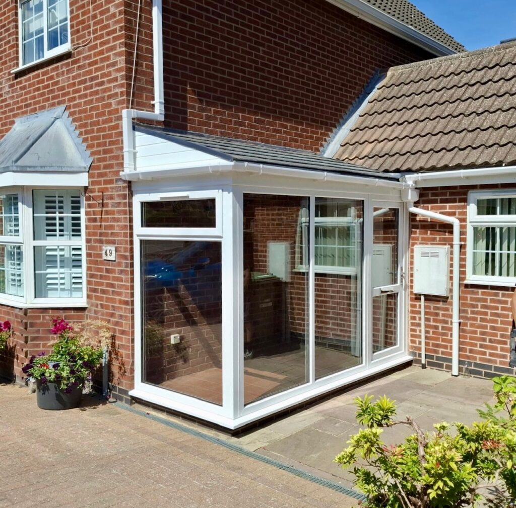 Custom glass porch with tiled roof in Bushby