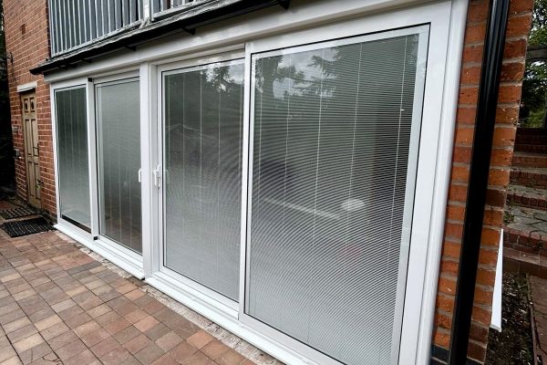 Aluminium sliding patio doors with magnetic integral blinds installed in Leicester