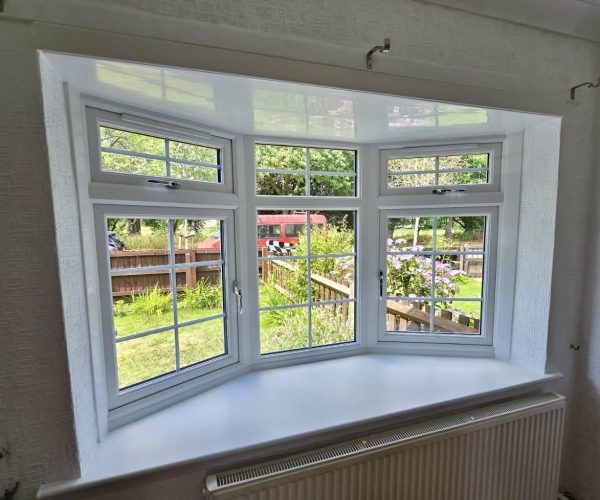 Bow white uPVC window with Georgian bar design