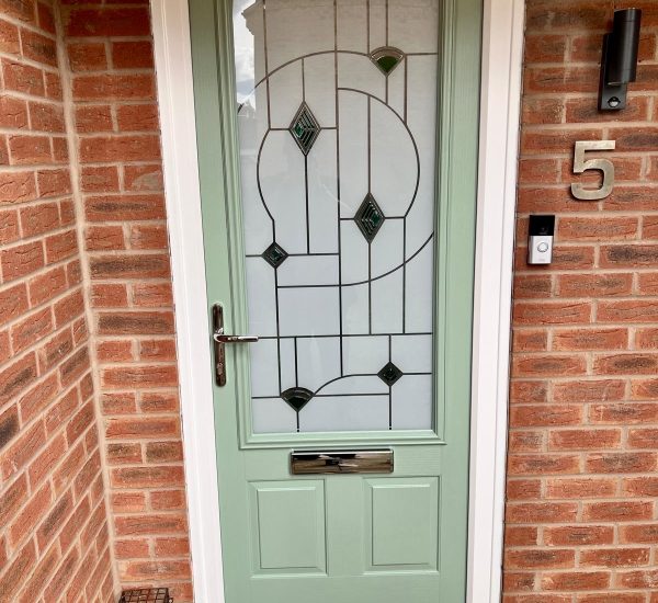 Chartwell green composite front door installation with patterned glass
