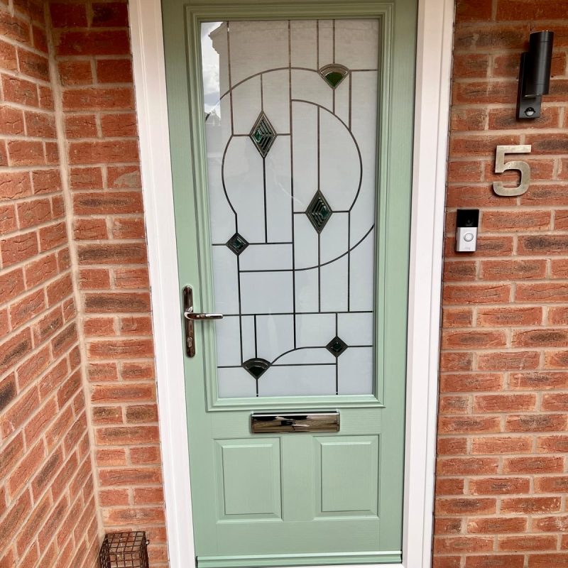 Chartwell green composite front door installation with patterned glass Chartwell green composite front door installation with patterned glass