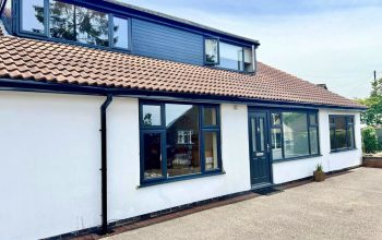 Anthracite grey double glazed windows installed in Leicester property with new roofline by Phair Windows