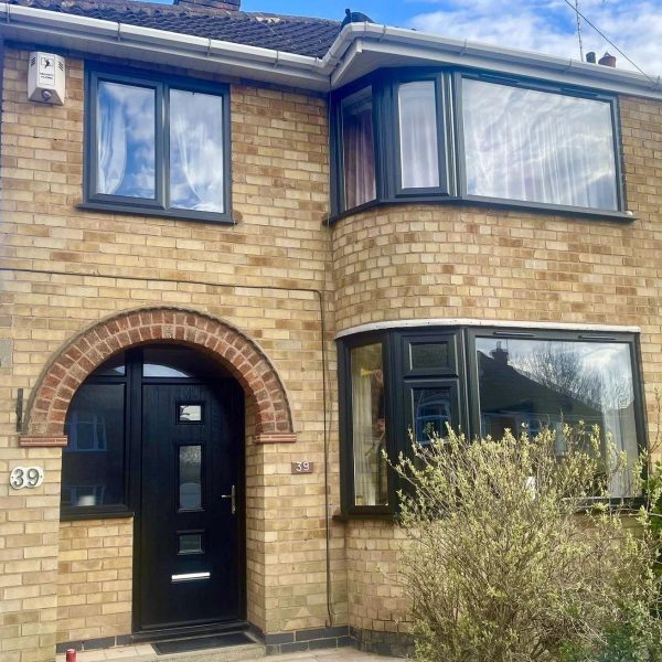 House with black uPVC double glazed windows and composite door