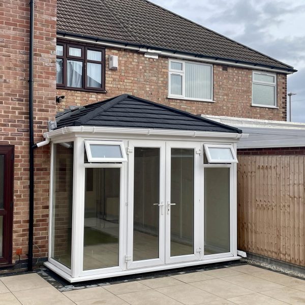 Tiled conservatory roof with Velux windows