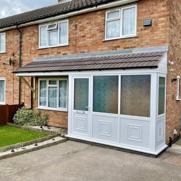 uPVC Double Glazed White Porch with Frosted Glass Front Door & Tiled Roof - Installed by Phair Windows & Glass, Leicester, Leicestershire